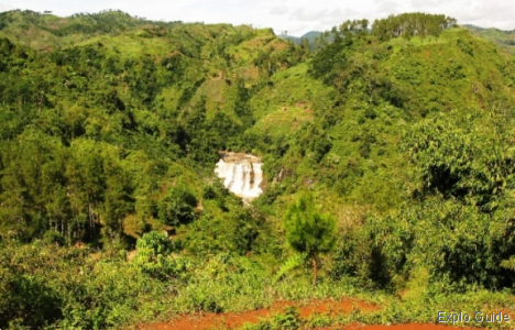 waterfall framed by the green ExploGuide - Off the Path Travel and Alternative Tourism database